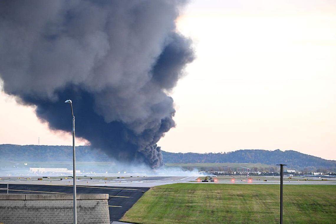 LOUISVILLE, KENTUCKY - NOVEMBER 04: Fire and smoke mark where a UPS cargo plane crashed near Louisville Muhammad Ali International Airport on November 04, 2025 in Louisville, Kentucky. The fully fueled plane crashed shortly after takeoff with a shelter-in-place order issued for within 5 miles of the airport. (Photo by Stephen Cohen/Getty Images)