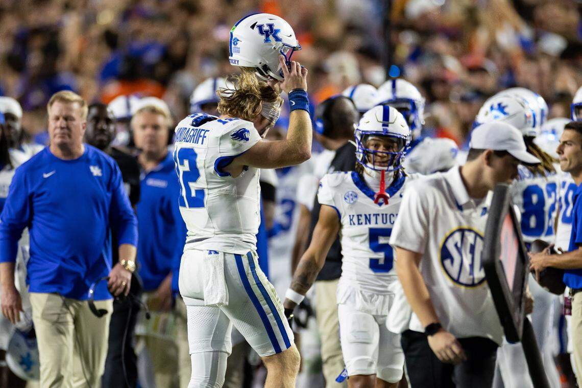 Oct 19, 2024; Gainesville, Florida, USA; Kentucky Wildcats quarterback Brock Vandagriff (12) takes off his helmet after an interception against the Florida Gators during the first half at Ben Hill Griffin Stadium. Mandatory Credit: Matt Pendleton-Imagn Images