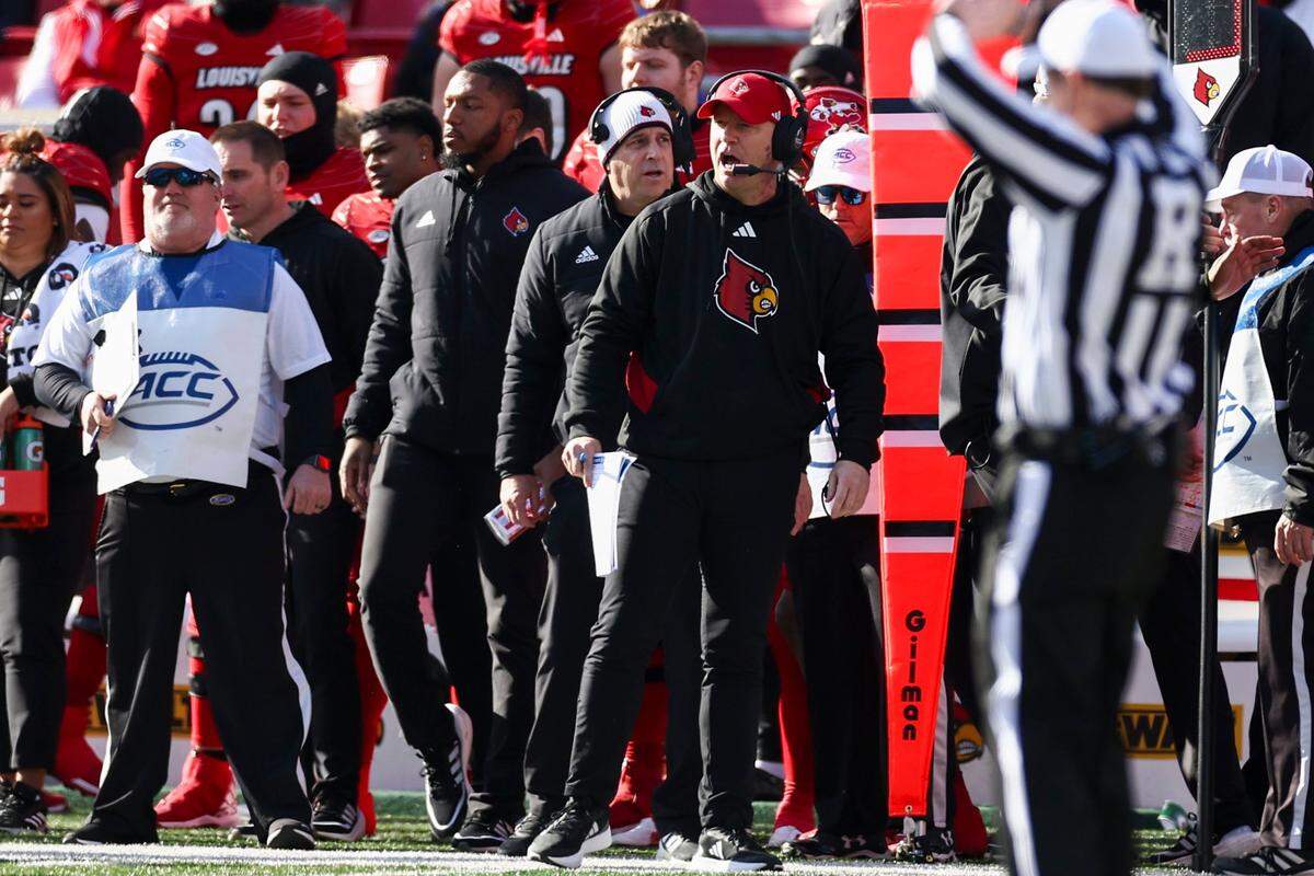 Louisville head coach Jeff Brohm shouts from the sidelines during Saturday’s game against Kentucky.