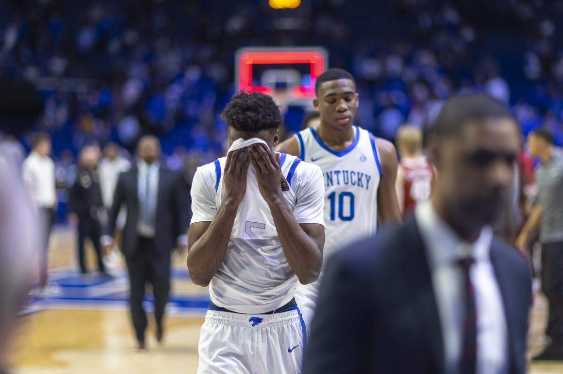 Kentucky’s Jaxson Robinson and Brandon Garrison (10) leave the court of Saturday’s loss to Alabama at Rupp Arena.