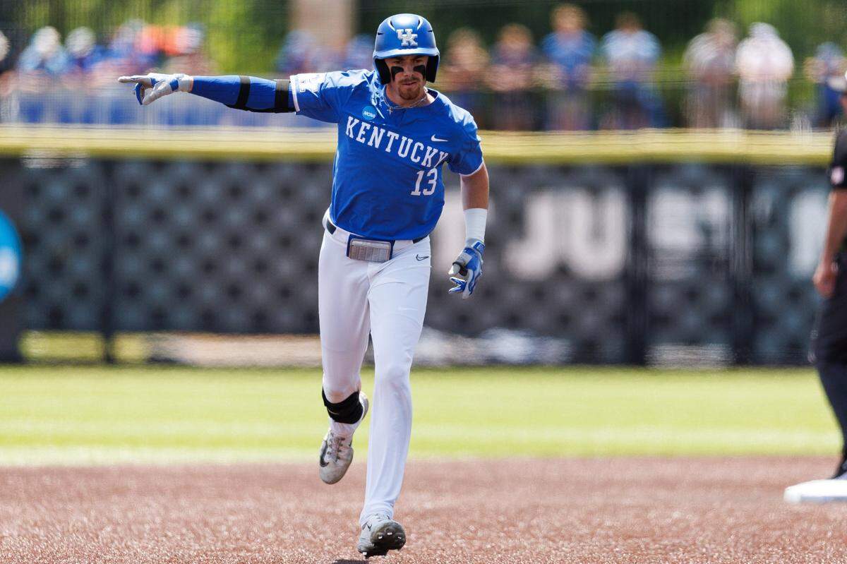 May 31, 2024; Lexington, KY, USA; Kentucky infielder James McCoy (13) celebrates after hitting a home run to score two runs during the during the second inning of an NCAA Division I Baseball Championship game between the Kentucky Wildcats and Western Michigan Broncos at Kentucky Proud Park. Mandatory Credit: Jordan Prather-USA TODAY Sports