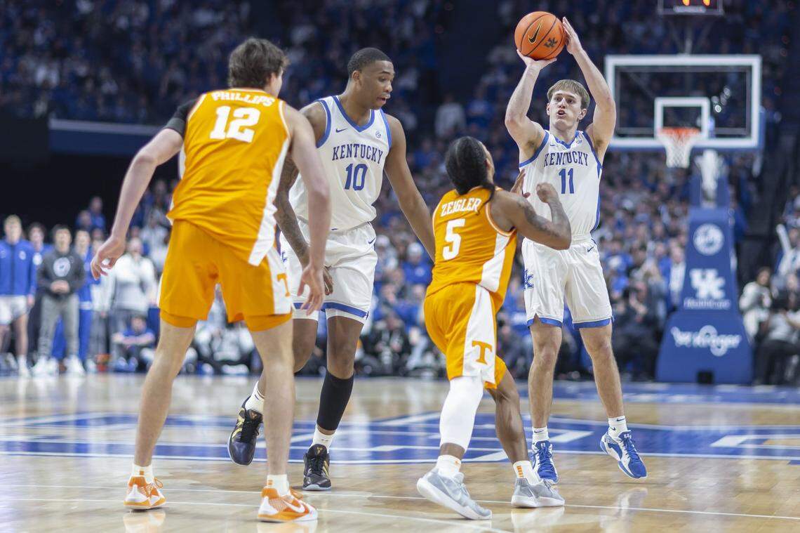 Kentucky’s Travis Perry (11) shoots over Tennessee’s Zakai Zeigler (5) during Tuesday’s game in Rupp Arena. Perry finished with eight points.