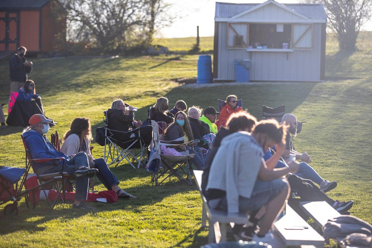 Spectators watch as Frankfort High School takes on Paris, Ky., High School in both teamsÕ first game of the season in Paris on Monday, March 29, 2021.
