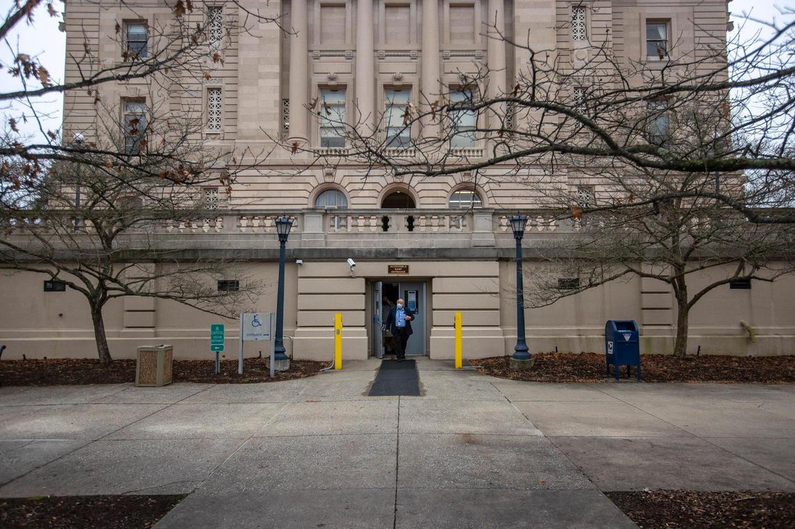 Longtime Lexington Herald-Leader Capitol Bureau Chief Jack Brammer leaves the building on his final day at the Kentucky state Capitol in Frankfort, Ky., on Wednesday, Dec. 29, 2021.