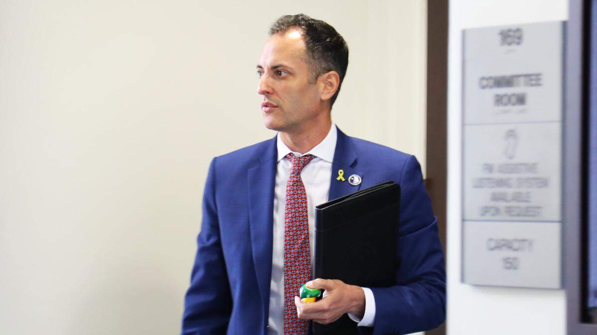 Rep. Daniel Grossberg (D- Louisville) is seen exiting a committee during a hearing of the Legislative Ethics Commission, with testimony from complainants of his alleged misconduct at the Kentucky Capitol annex in Frankfort on June 17, 2025. 