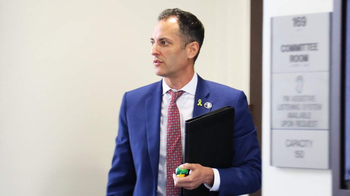Rep. Daniel Grossberg (D- Louisville) is seen exiting a committee during a hearing of the Legislative Ethics Commission, with testimony from complainants of his alleged misconduct at the Kentucky Capitol annex in Frankfort on June 17, 2025. 
