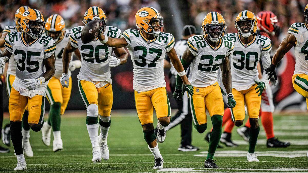 Carrington Valentine (37) and his Green Bay Packers teammates celebrate after he made an interception against the Cincinnati Bengals during a preseason game on Friday night.