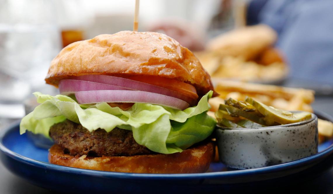 The Bluegrass Burger at Infinity: Skybar & Cafe. The prime steakhouse burger comes with house-made pickles and a secret sauce on a brioche bun.