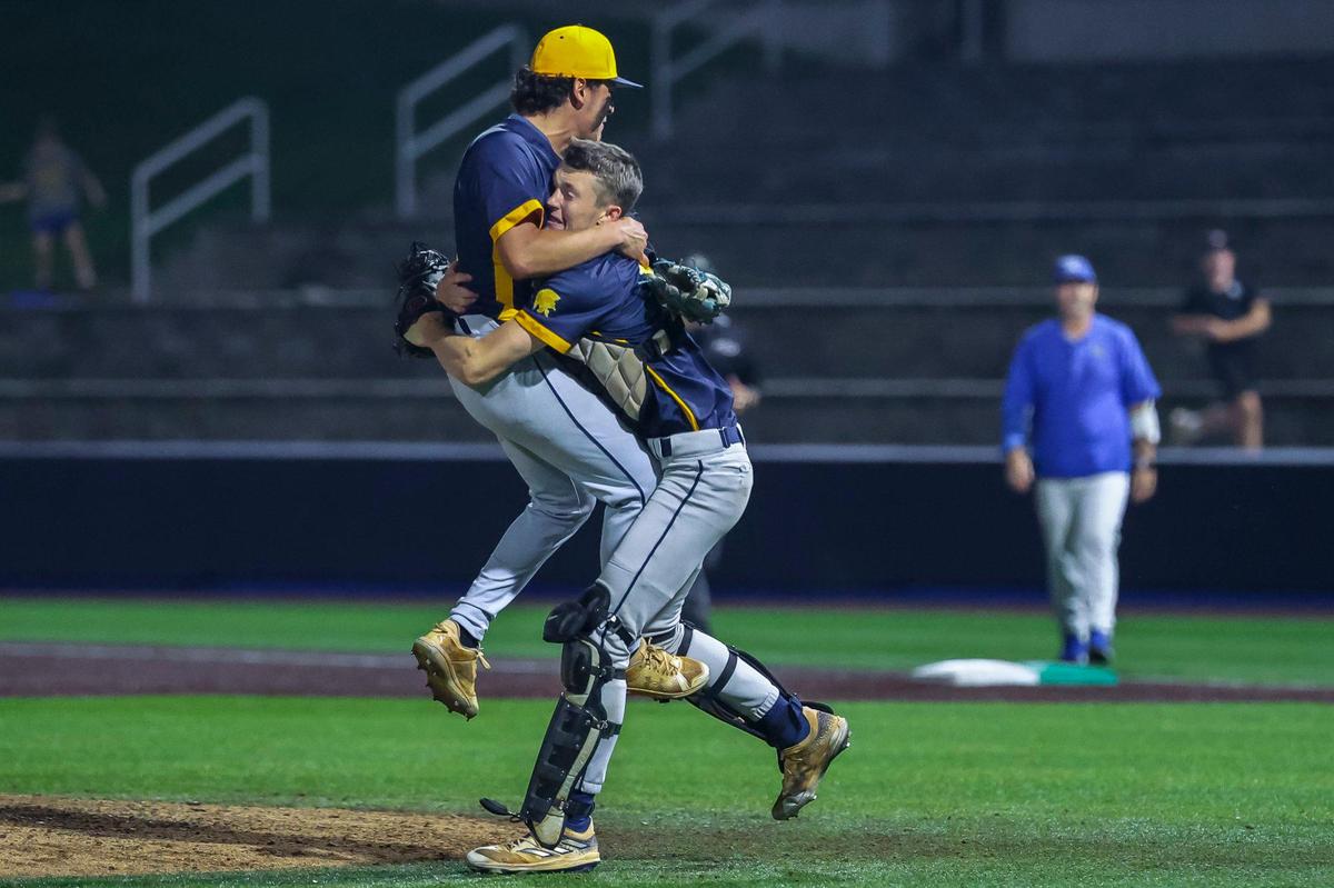 Sayre pitcher Lucas Saatman celebrates the final out with catcher Robbie Jenkins at Kentucky Proud Park.