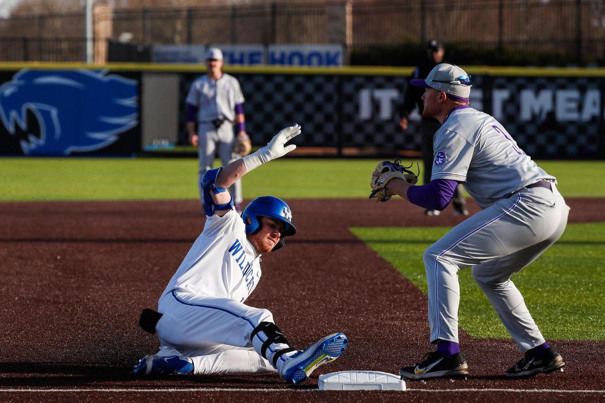 Kentucky’s James McCoy slides into third base with an RBI triple during the Wildcats’ 6-3 win over Evansville on Tuesday.