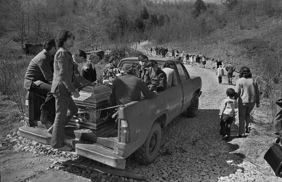 Friends and family accompany a Scotia miner to his resting place in a mountain cemetery.