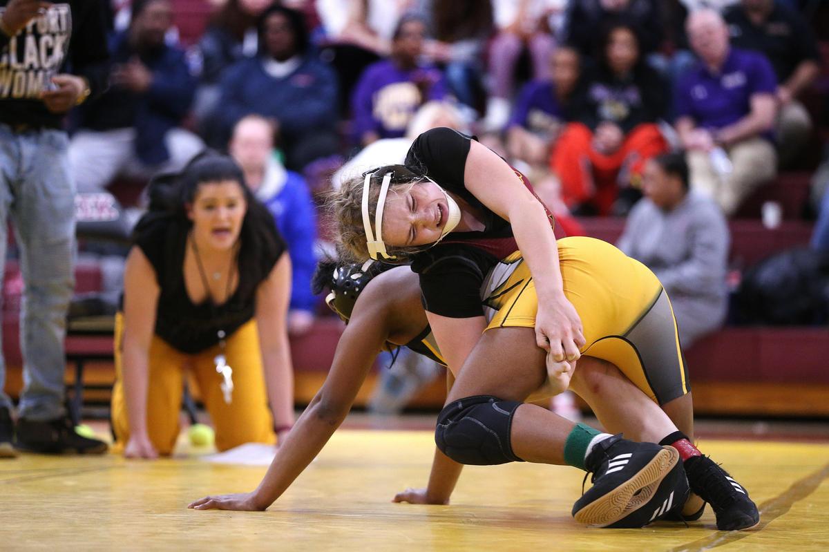 Harrison County’s Rileigh Funkhouser, top, defeated Central’s Ronesha Rice in the 126-pound state championship match last Saturday.