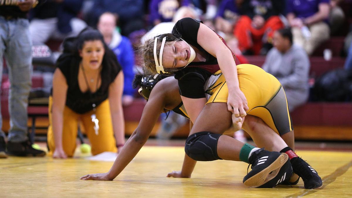 Harrison County’s Rileigh Funkhouser, burgundy, wrestled Central’s Ronesha Rice in the finals of the 126-pound weight class during the 2020 Kentucky Girls’ State Championships at Tates Creek High School. Tates Creek will again be the site for the 2022 state championships on Saturday.