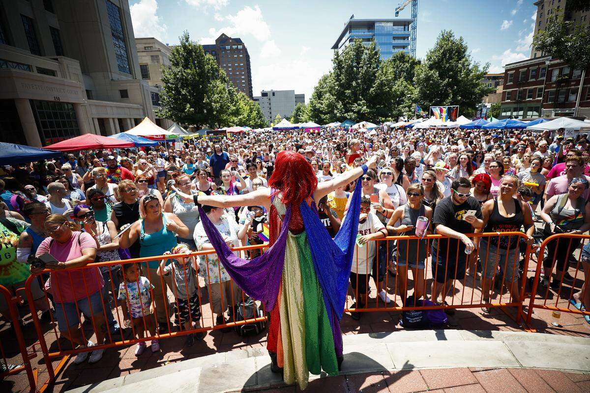 Joshua McKinley, of Lexington, performing as Jameson Brooks, interacts with the crowd during a drag show during the 2019 Lexington Pride Festival at Courthouse Plaza in downtown Lexington, Saturday, June 29, 2019.