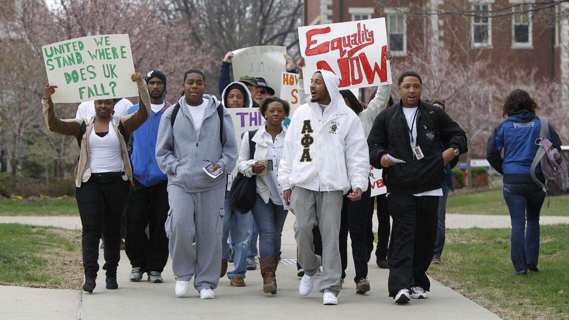 A group of about 15 students walked near the UK Administration Building on Thursday during a demonstration opposing ignorance and bigotry. The demonstrations were in response to a sign that read "How do you spell Nigger: OBAMA" that was found recently at a bus shelter beside campus.    
