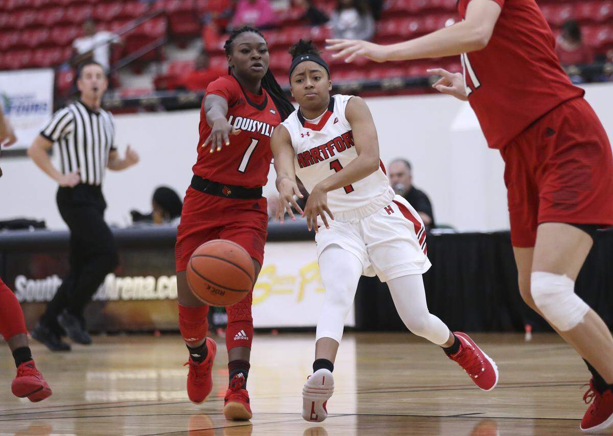 Louisville sophomore guard Dana Evans, left, is averaging 9.4 points and leads the Cardinals in assists (43) and steals (18) even though she usually comes off the bench.