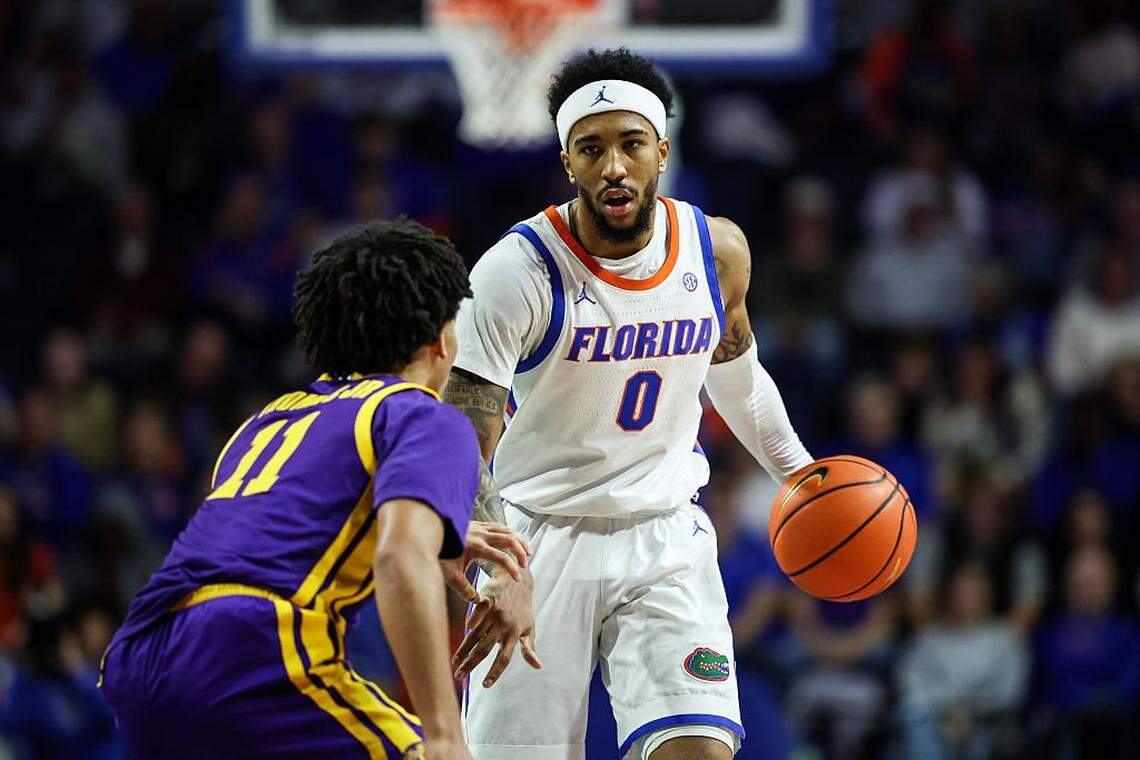 GAINESVILLE, FLORIDA - JANUARY 20: Boogie Fland #0 of the Florida Gators brings the ball up court against Dedan Thomas Jr. #11 of the LSU Tigers during the first half at the Stephen C. O'Connell Center on January 20, 2026 in Gainesville, Florida. (Photo by James Gilbert/Getty Images)
