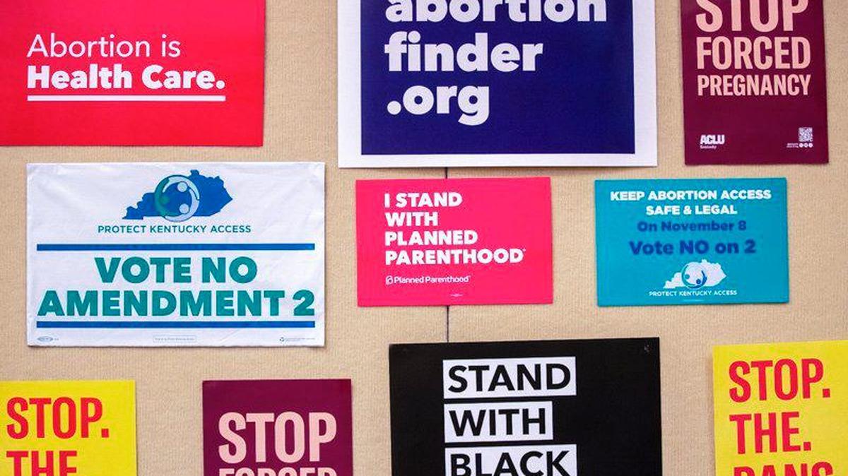 Signs are tacked to the wall at Protect Kentucky Access’ election watch party the Galt House in Louisville, Ky., Tuesday, Nov. 8, 2022. Lexington has set up collection sites for political signs and will be reusing the materials.