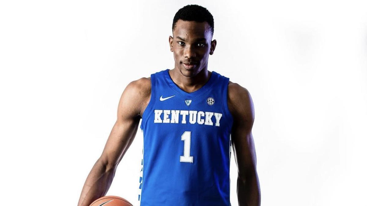 Ugonna Onyenso posed for photos wearing a Kentucky basketball uniform will on his official visit to Lexington in July.