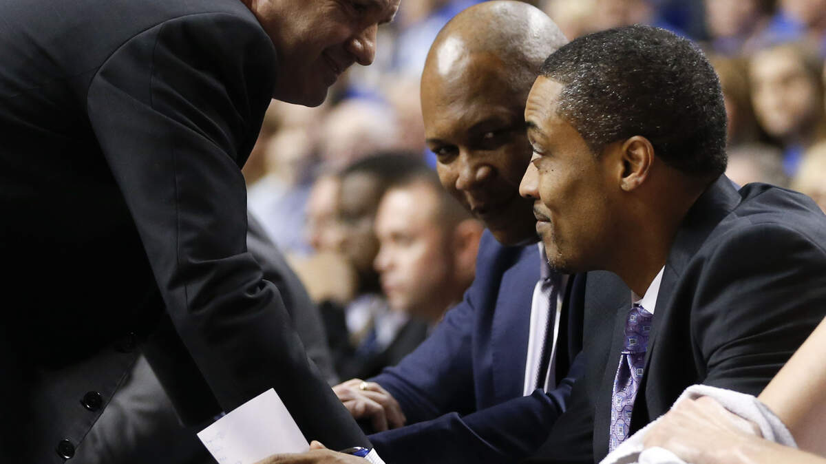 Kentucky coach John Calipari talked with assistant coaches Kenny Payne, left, and Rod Strickland on Saturday during the Wildcats' 72-62 win against Auburn.  Photo by Mark Cornelison | Staff