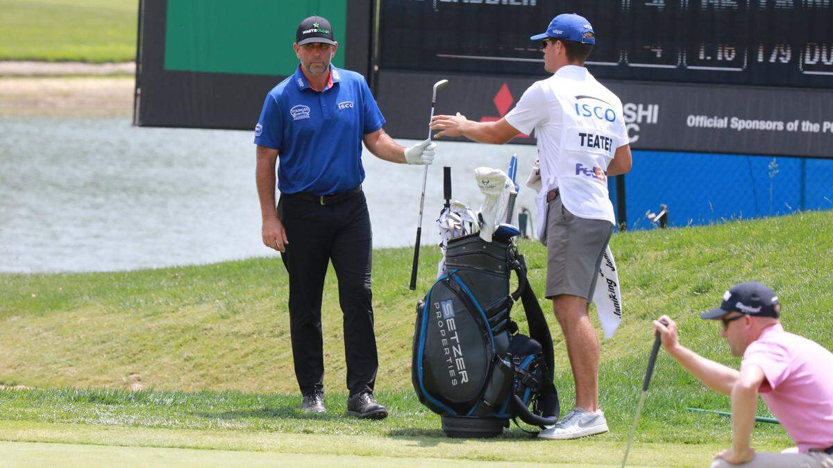 Josh Teater hands a club to his caddie on the ninth hole during the second round of the 2024 ISCO Championship at Champions at Keene Trace Golf Club in Nicholasville on Friday. Despite shooting -7 after two rounds, Teater missed the cut at this year’s event.