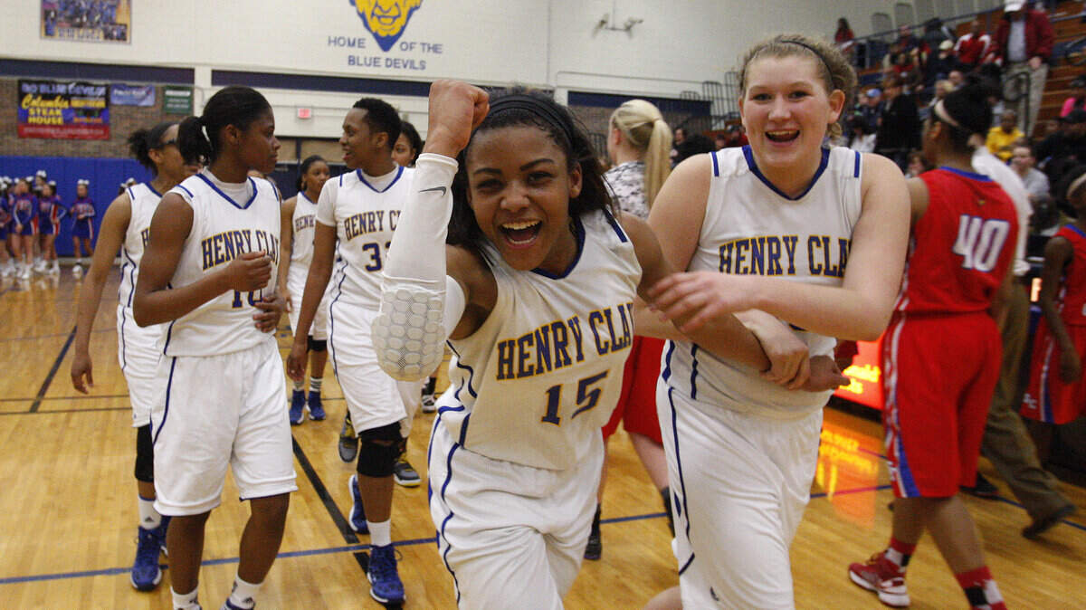 Henry Clay's Kamari Boyd, left, celebrated with Hannah Young following the Blue Devils' win against Scott County in the 42nd District championship game.    
