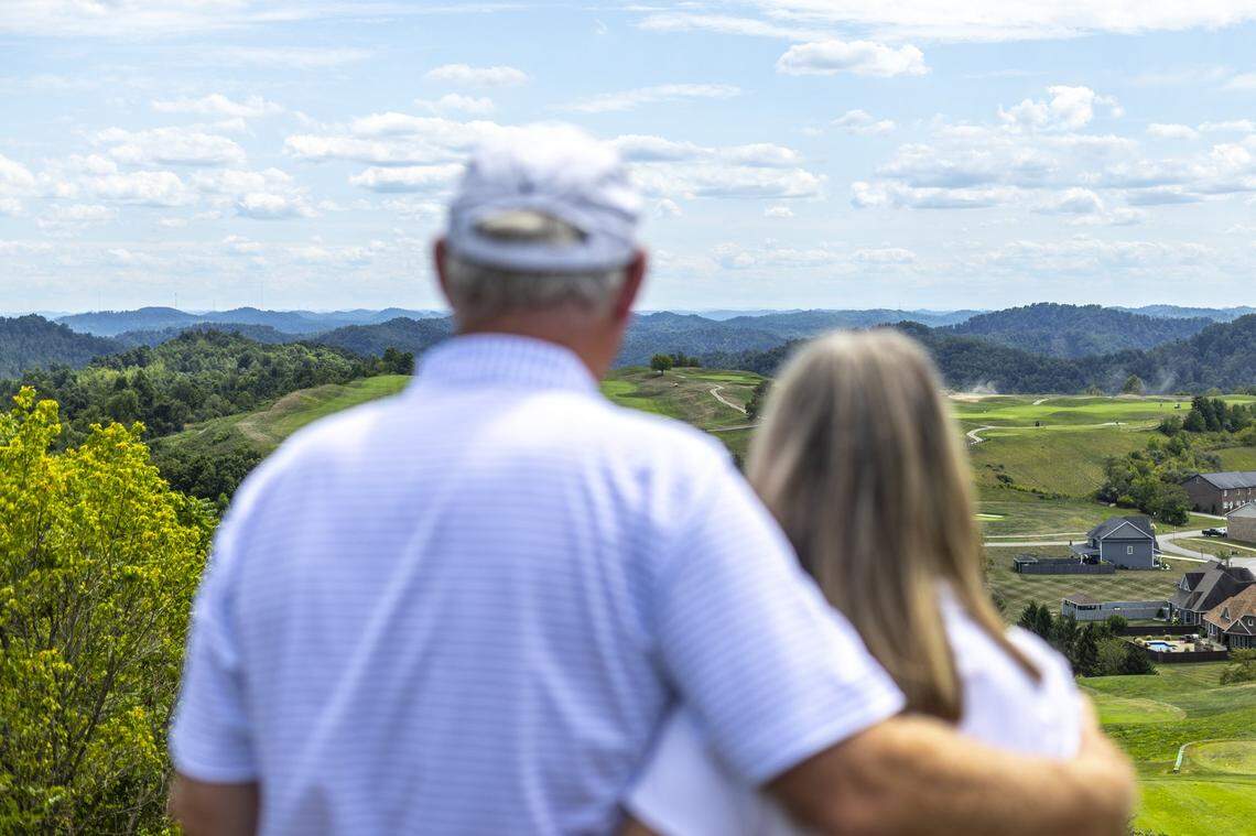 Pat Tallent, a high school basketball star at Maytown High School in Floyd County in the 1970s, left, and his wife, Cindy, look over StoneCrest Golf Course in Prestonsburg. Returning to Eastern Kentucky after both he and his wife had successful business careers, Pat Tallent has invested his own money to make StoneCrest, a city-owned venue, into a golf course nice enough that people will visit from out of the area to play it.