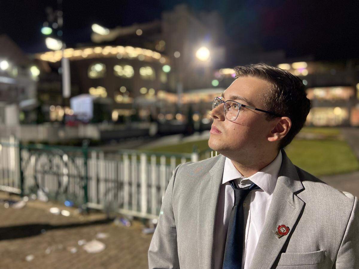 Lexington Herald-Leader sports reporter Cameron Drummond poses for a portrait on Saturday at Churchill Downs in Louisville after attending the Kentucky Derby for the first time. Drummond bet on Zandon and Barber Road to win the Kentucky Derby, which was won by 80-1 long shot Rich Strike.