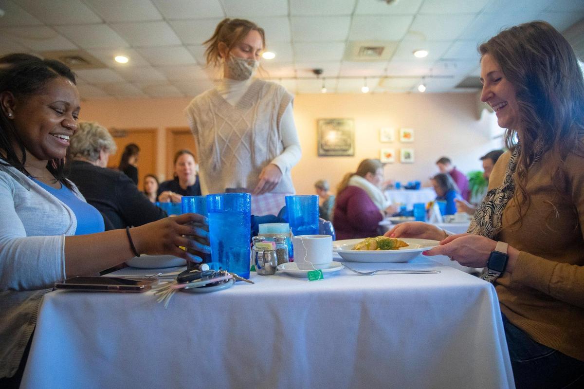 Loretta Stafford, left, an Bailey Ubellacker receive their entrees at the Lemon Tree in Erickson Hall on the University of Kentucky campus on Tuesday, Feb. 15, 2022. Reservations for the student-run campus restaurant fill up quick. Meals are only $14 and tips are not allowed.