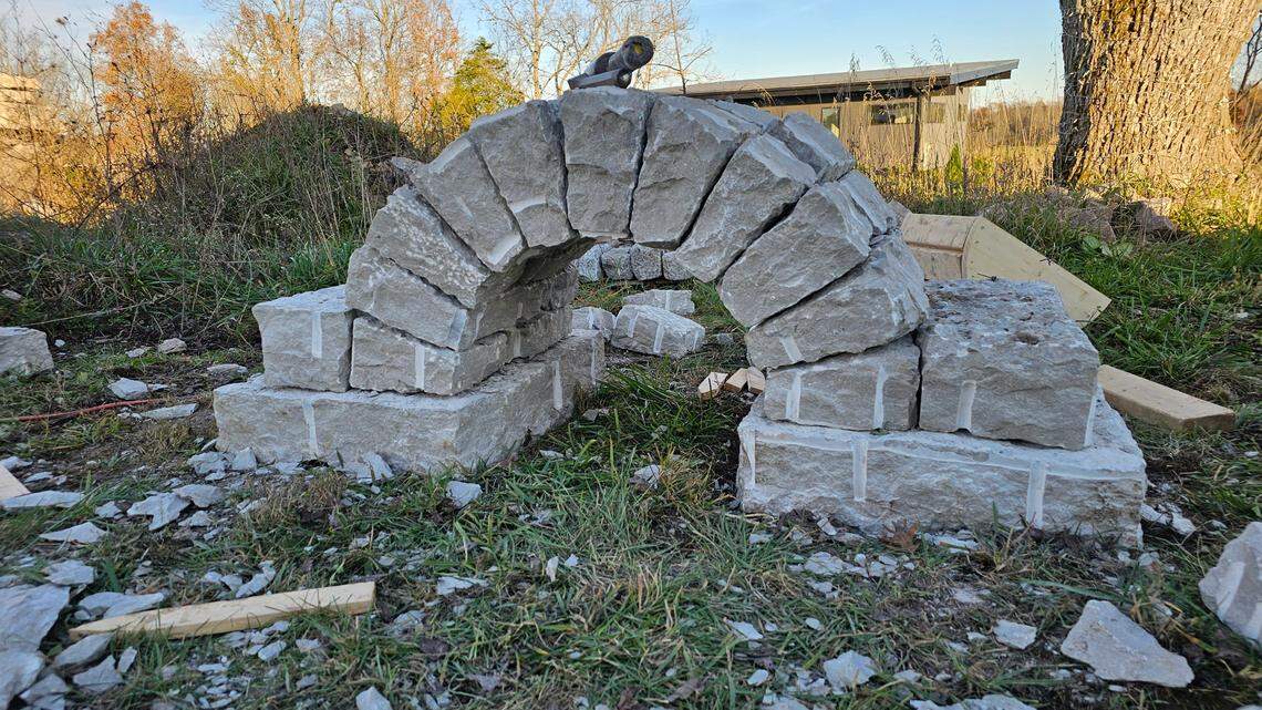 Attendees of a Dry Stone Conservancy two-day workshop on cutting and shaping stone learn to build an arch on Nov. 22, 2024.