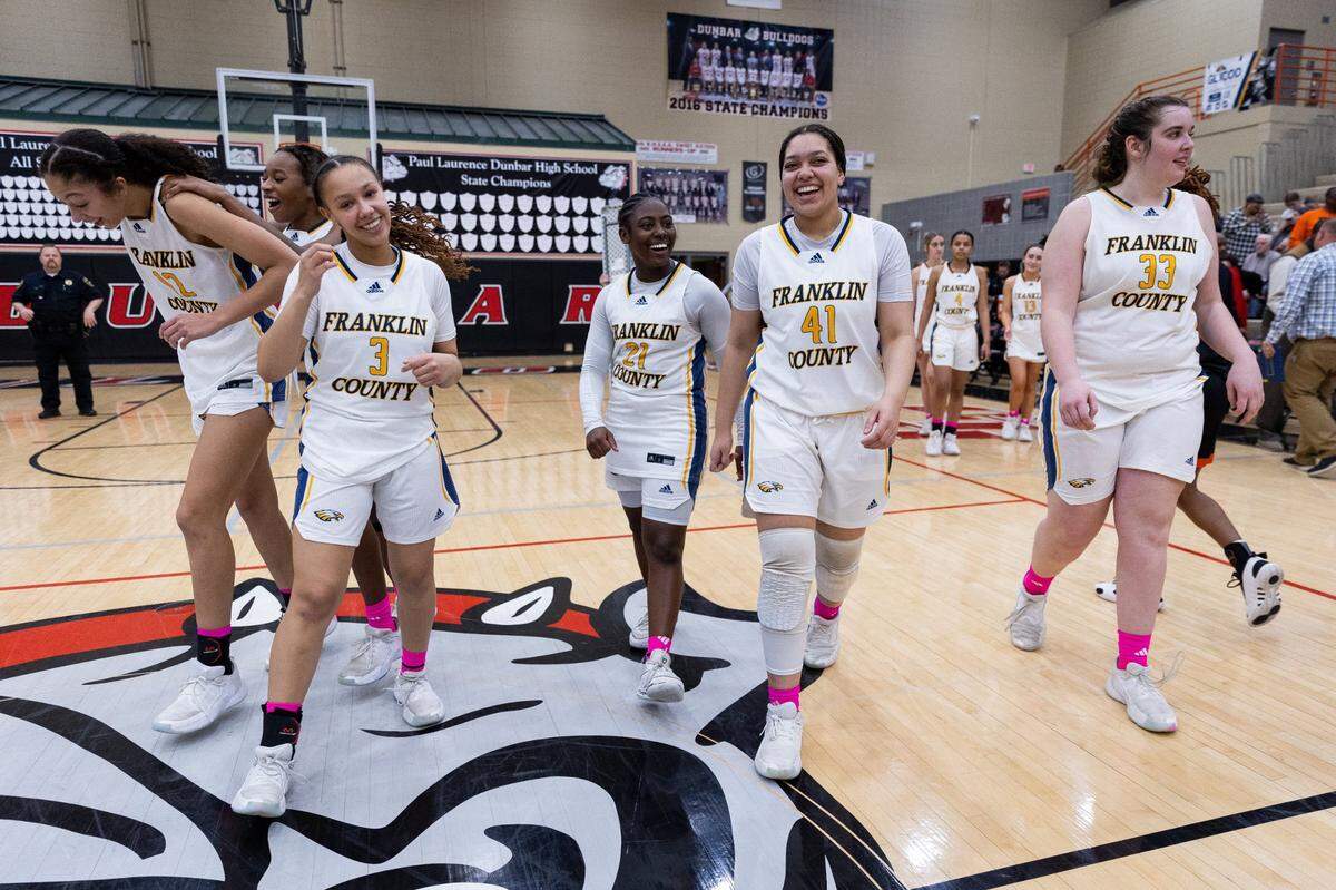 Franklin County players celebrate their win against Frederick Douglass in the 11th Region finals at Paul Laurence Dunbar on Saturday.