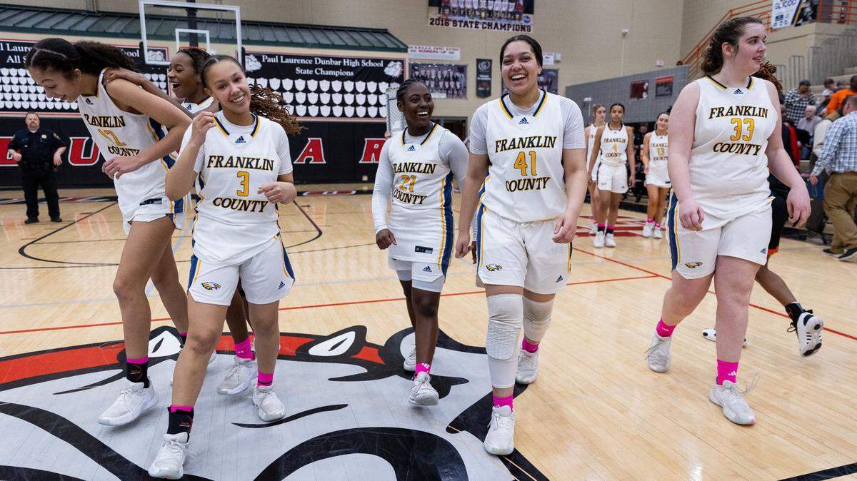Franklin County players celebrate after winning the 11th Region championship at Paul Laurence Dunbar High School on Saturday. The Flyers will face North Laurel in the first round of the Sweet 16 on Wednesday.