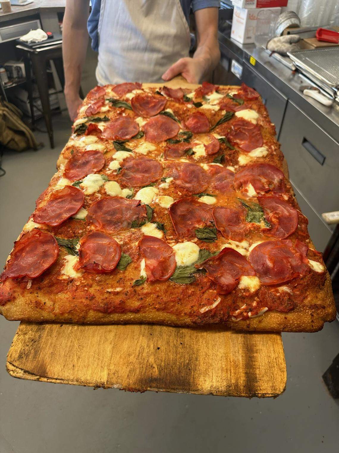 Dingbats Pizza on Jefferson Street serves Roman-style pizza with a doughy focaccia-like crust. The new restaurant serves pizza by the rectangular pie or by the pound: One slice weighs about a half-pound.