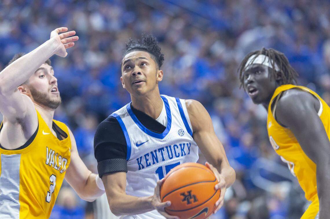 Kentucky guard Jaland Lowe (15) shoots the ball as Valparaiso guard Brody Whitaker (3) defends during Friday’s game at Rupp Arena.