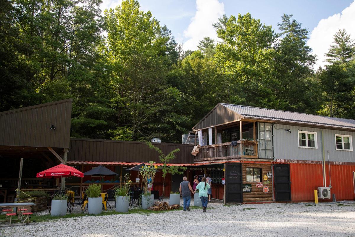 Customers go to the walk-up order window at Hop’s Beer Garden and Restaurant in the Red River Gorge August 14, 2021.