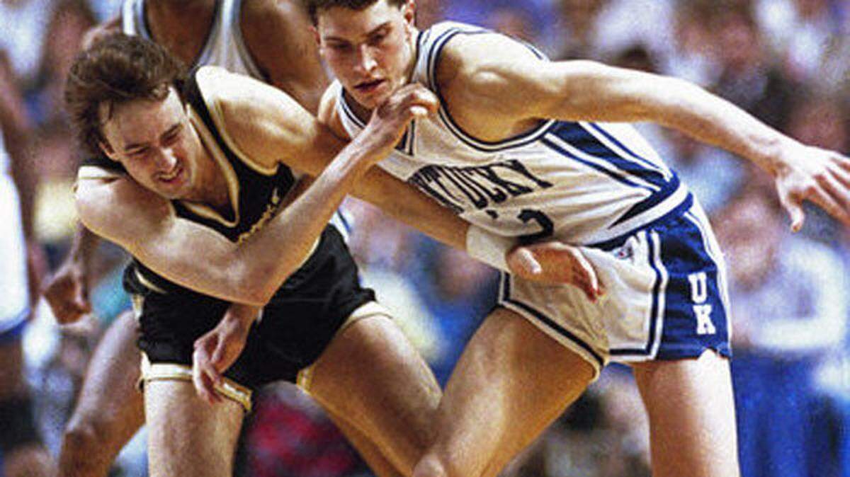 Kentucky's Rex Chapman battled Vanderbilt's Barry Goheen for a loose ball on Jan. 1, 1988, in Rupp Arena. Chapman played two seasons for Kentucky, averaging 17 points a game for his college career, before departing for the NBA.