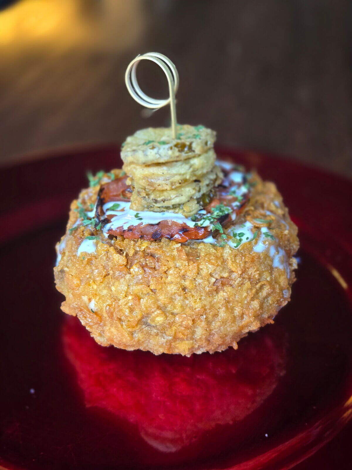 Chef D’s Barrel-Rific Burger from Barrel 53 for Lexington Burger Week 2026 is topped with fried pickles, charred tomato, and drizzled with house made ranch.