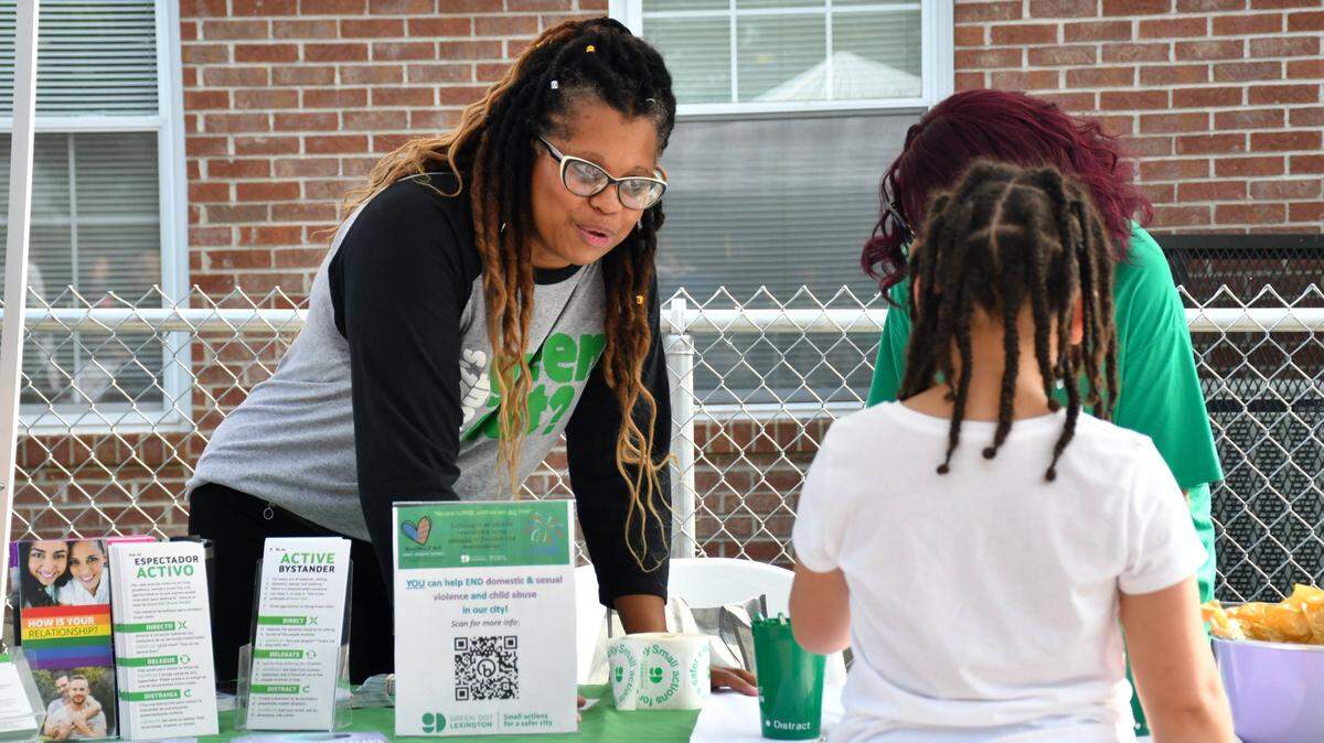 Dawn Runyon interacts with someone interested in the Green Dot booth during Winburn Public Safety Day on Wednesday, June 28, 2023 at the Community Action Council Center in Lexington, Ky.
