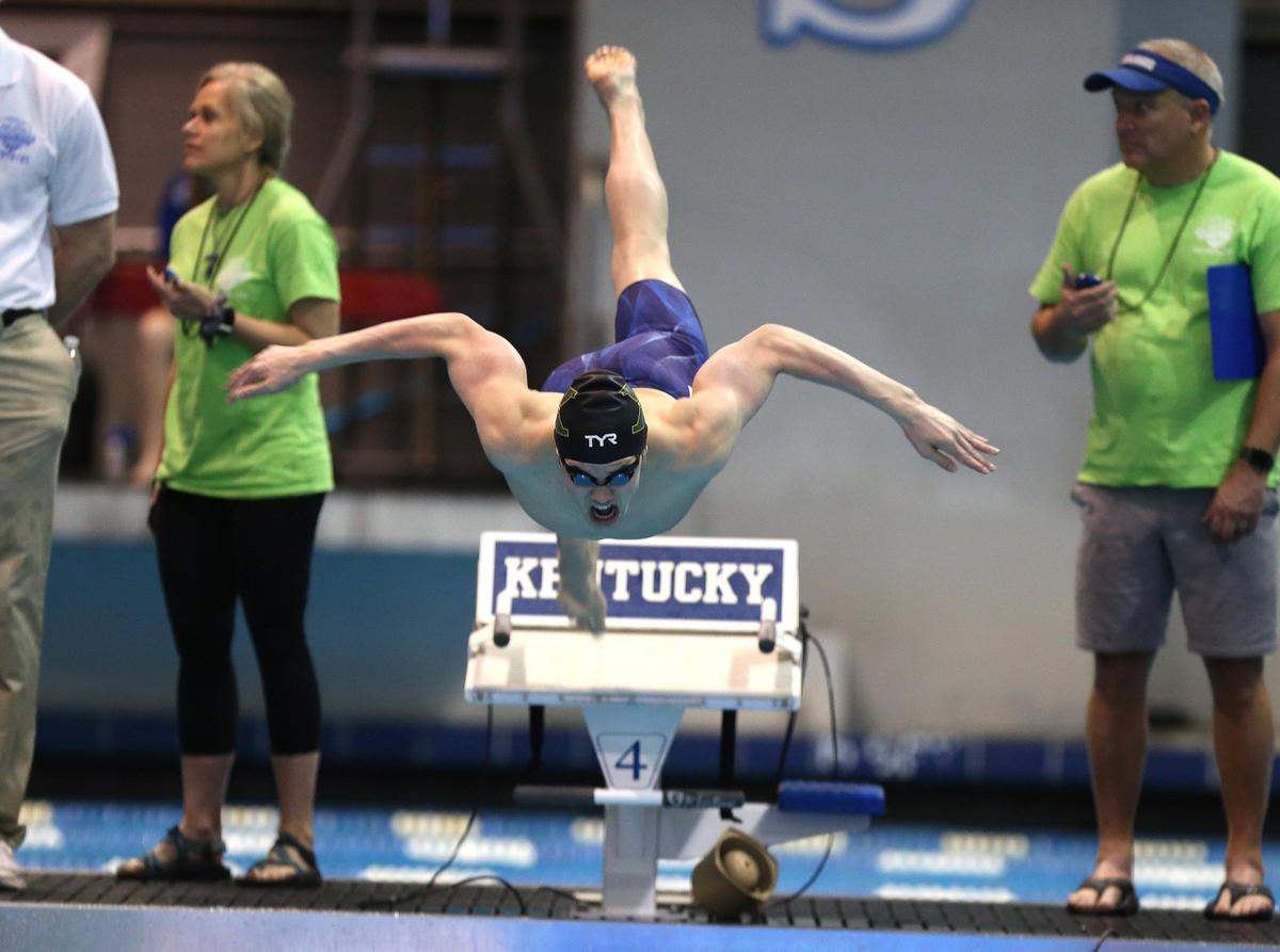 St. Xavier’s Holden Smith launched his victory in the 100-yard butterfly at UK’s Lancaster Aquatic Center on Saturday. He also won the 200 individual medley.