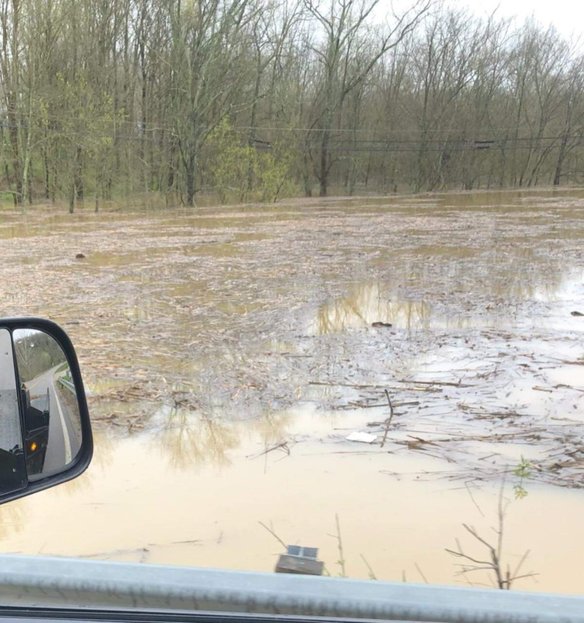 Waters rise near a bridge heading into Butler, Kentucky, on April 5, 2024. Officials in Pendleton County issued an emergency evacuation for Butler and Falmouth as the Licking River continued to rise.