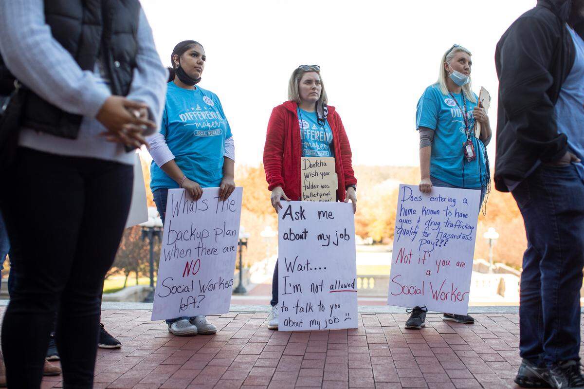 State social service workers gather at the capitol and sit in on a joint House-Senate budget committee to protest pay rates and staffing shortages in their ranks at the capitol in Frankfort, Ky., Monday, November 15, 2021.
