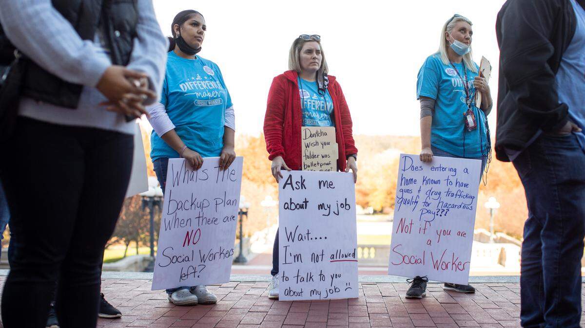 State social service workers gather at the capitol and sit in on a joint House-Senate budget committee to protest pay rates and staffing shortages in their ranks at the capitol in Frankfort, Ky., Monday, November 15, 2021.