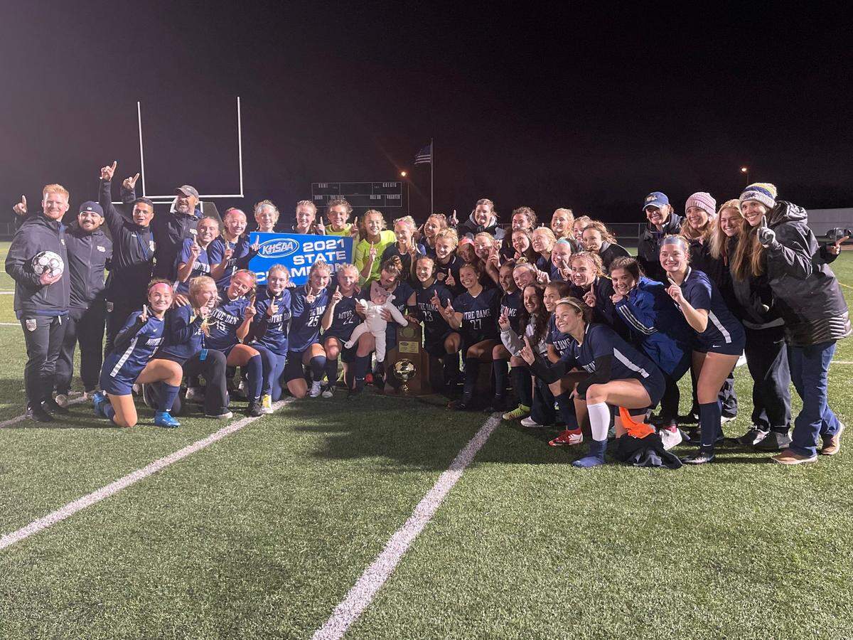 Notre Dame Academy posed with its 2021 KHSAA Girls’ Soccer State Championship trophy after defeating South Oldham 1-0 on Saturday night.