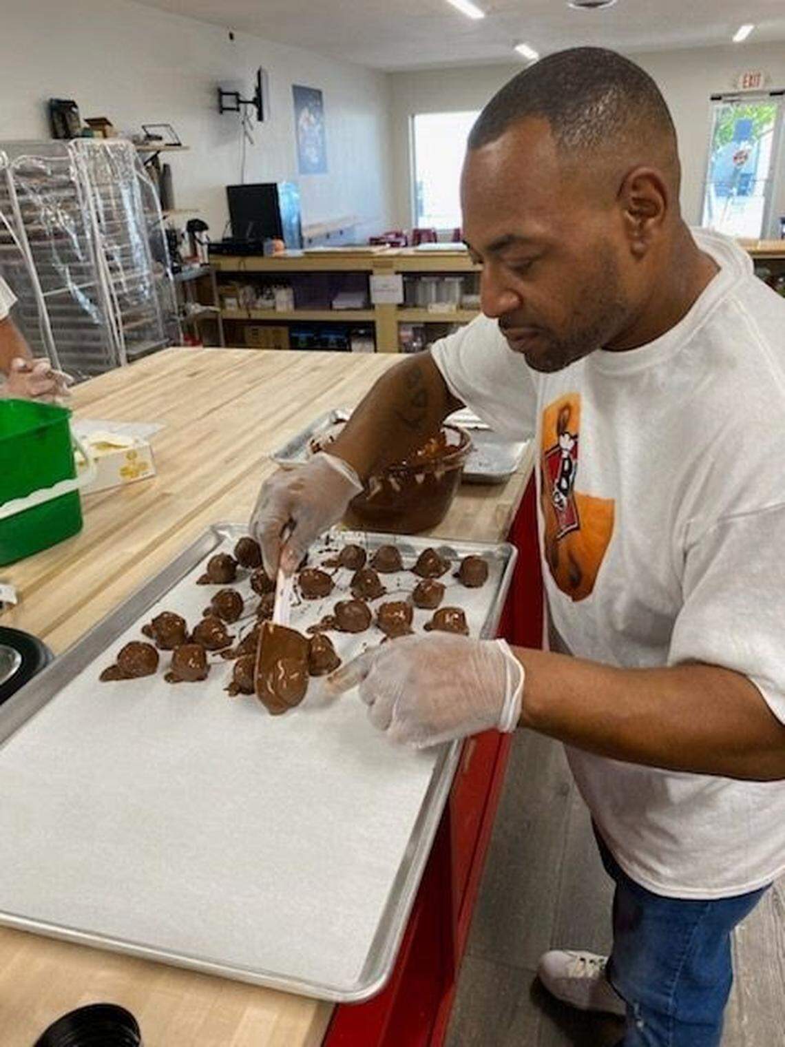 BK’s Cookies & More owner Leon Buford-Kelly makes brownie balls and other cookies by hand for his new storefront off Southland Drive. He started selling cookies while working as an associate principal at Leestown Middle School.