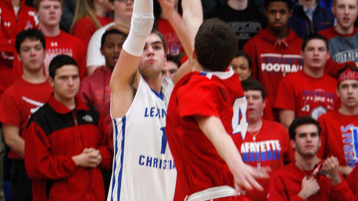 LCA's Benton Nighbert shoots a 3-pointer against Lafayette in the gymnasium at Lexington Christian Academy in Lexington, Ky., Friday, January 16, 2015. Photo by Matt Goins