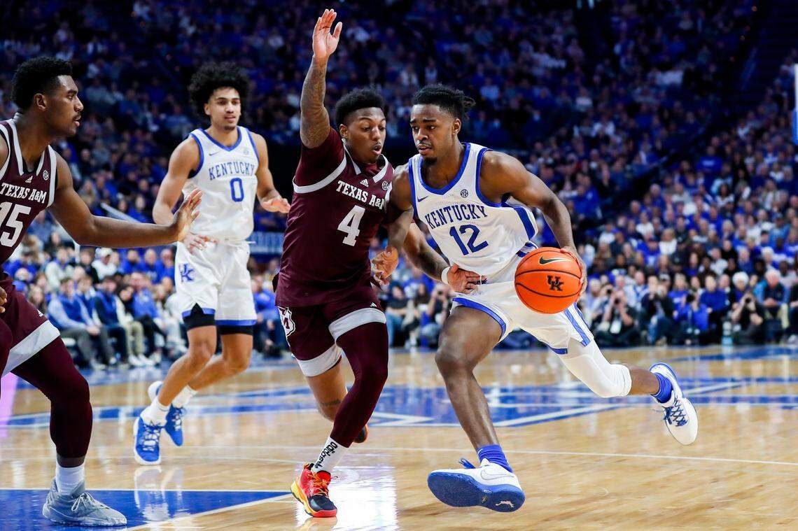 Kentucky Wildcats guard Antonio Reeves (12) drives to the basket against Texas A&M Aggies guard Wade Taylor IV (4) during the game at Rupp Arena in Lexington, Ky., Saturday, January 21, 2023.