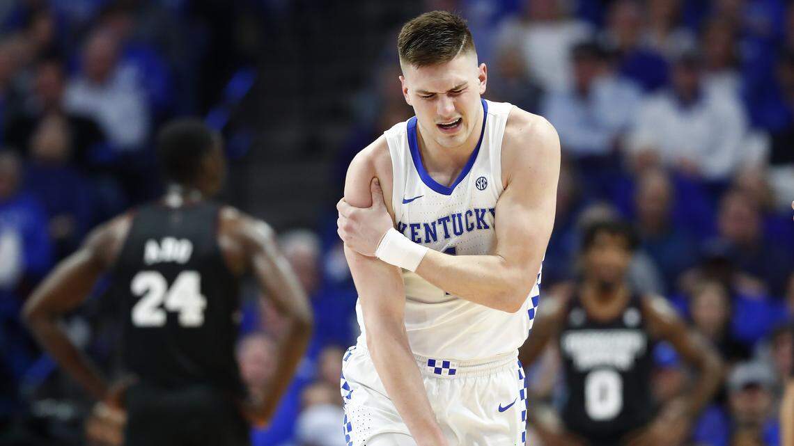 Kentucky Wildcats forward Nate Sestina grabs his shoulder in pain during a game against the Mississippi State Bulldogs, Feb. 4, 2020. Shoulder injuries are common with overuse.