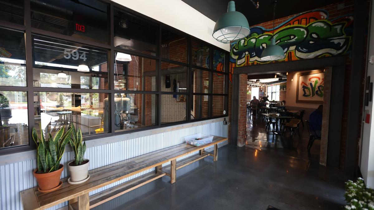 Entry space of the new DV8 Kitchen on the corner of East Third and Midland has a display window looking into the larger bakery space.