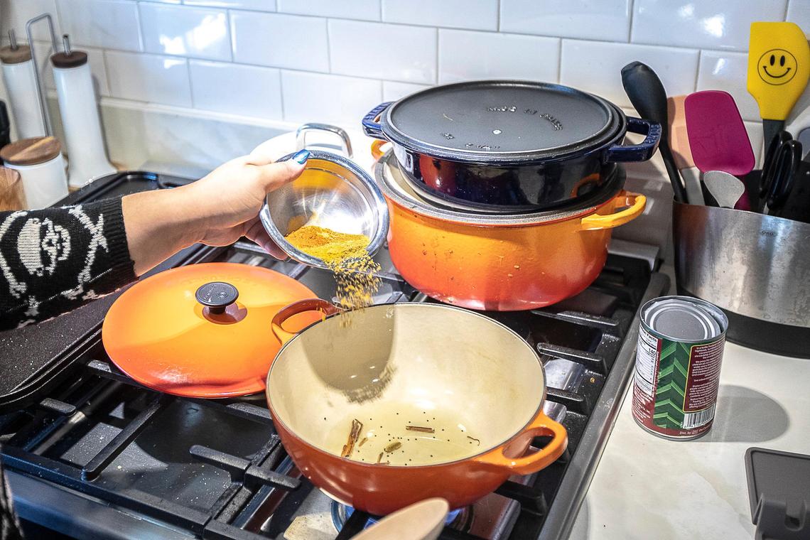 Samantha Fore prepares a mango curry. She’s made a name for herself with her innovative dishes.