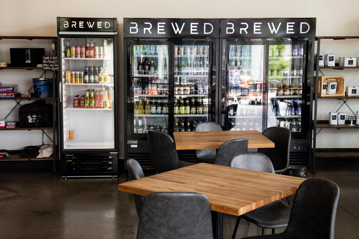 Customers select beer from the fridge themselves at Brewed.